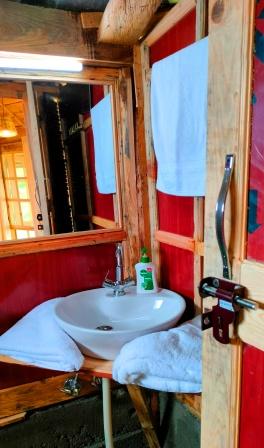 Clean and hygienic washrooms in Luxury wooden Machaan Cottage in Bir Billing